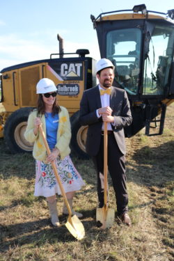 standing with shovels, groundbreaking
